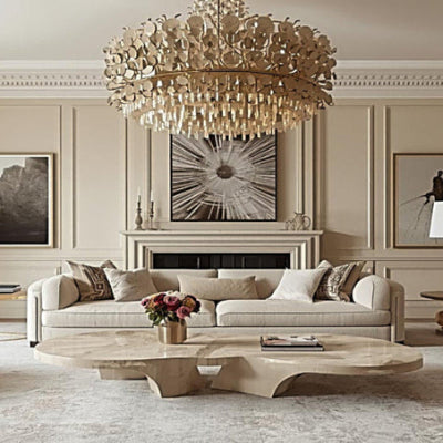 Luxurious living room with a chandelier, sofa, and coffee table.