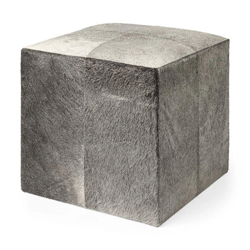 Cube-shaped ottoman with gray and white fur pattern on a white background