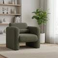 Olive green boucle upholstered arm chair with wide armrests and lumbar toss pillow