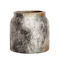 Vintage-style ceramic pot with a textured surface on a white background
