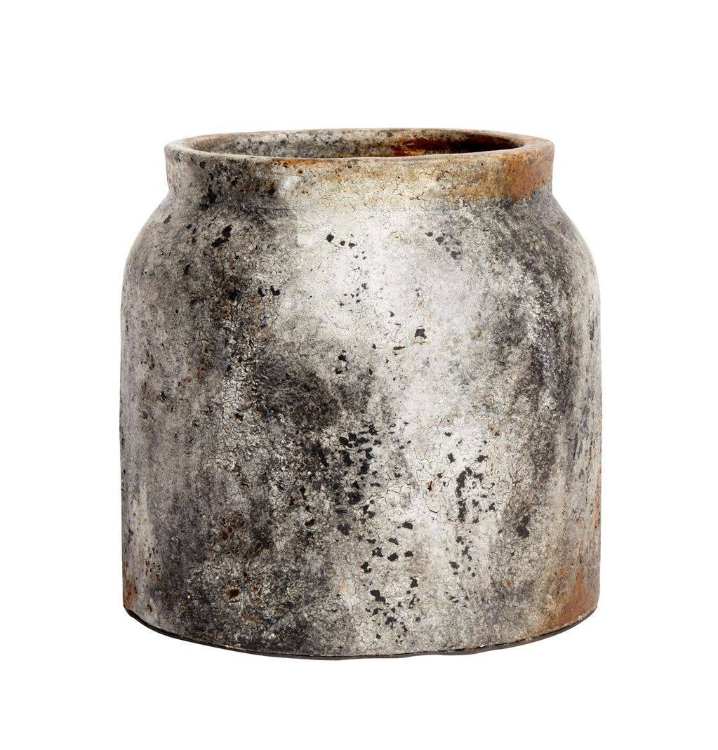 Vintage-style ceramic pot with a textured surface on a white background