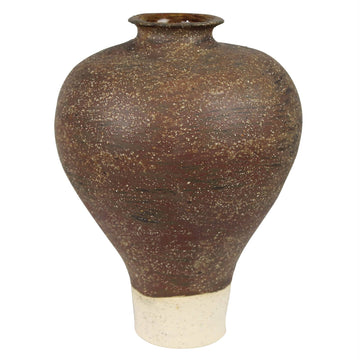 Brown ceramic vase with textured surface on a white background