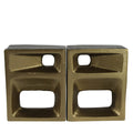 Pair of gold bookends on a white background