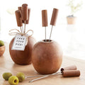 Wooden apple-shaped fruit skewer sets with a 'Take Your Pick!' tag on a wooden surface.