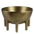 Gold metallic bowl with legs on a white background