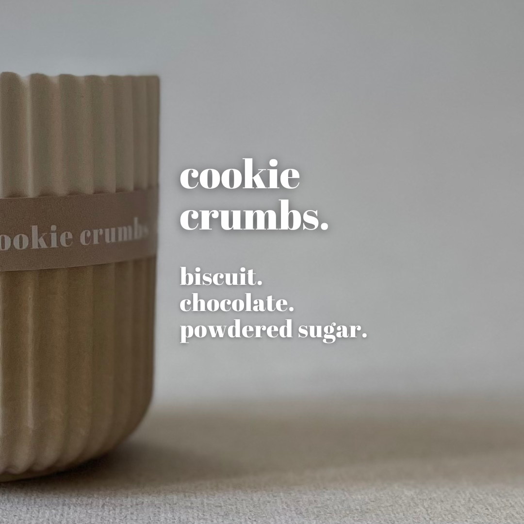 Container labeled 'cookie crumbs' with text describing ingredients on a neutral background