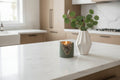 Decorative items on a kitchen counter with a modern kitchen background