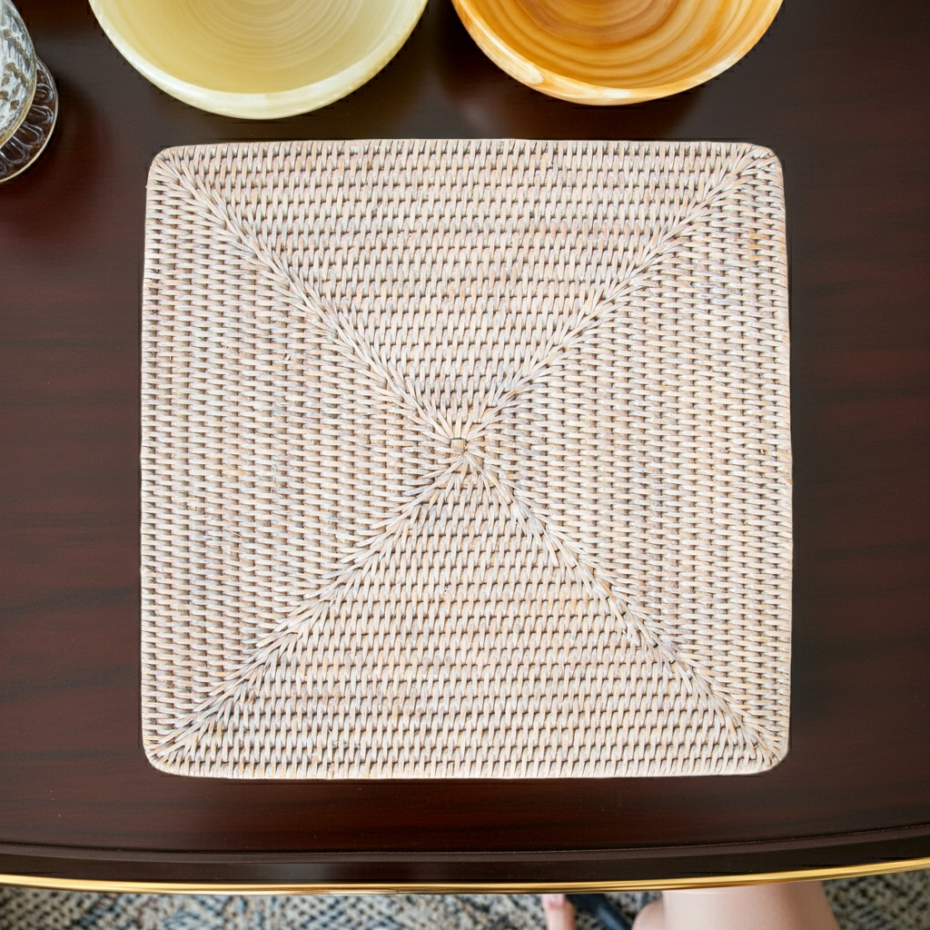 Woven square placemat on a dark surface